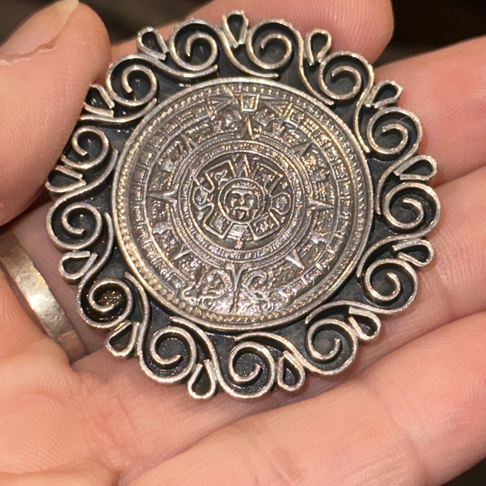 Vintage sterling silver pin/pendant from Mexico.